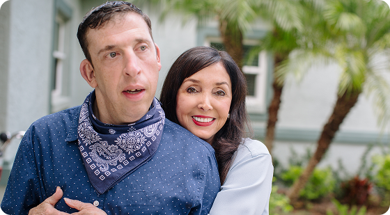 Reducing Convulsive Seizures in Dravet Syndrome Patients | Smiling Woman Hugging Man